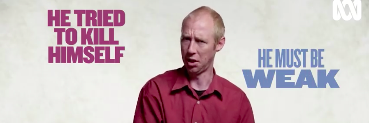 A man in the middle of answering a question. Text on the screen reads: He tried to kill himself, he must be weak.