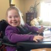 little girl in standing wheelchair