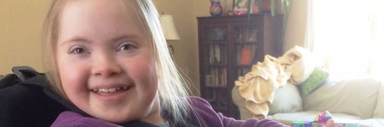 How We Find Hope for a Cure to Charcot-Marie-Tooth Disease Type 4 little girl in standing wheelchair