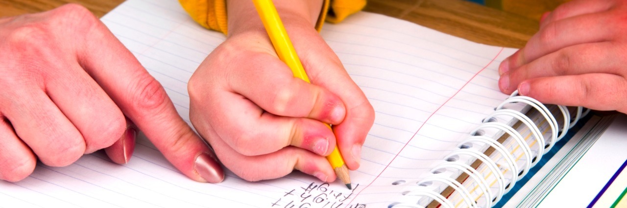 Navigating Parenthood, Chronic Illness, Homeschooling and Chemo Mother or teacher helping boy with homework