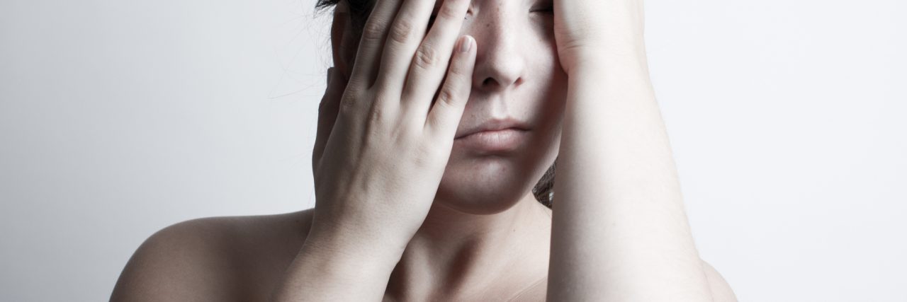 What Panic Attacks Feel Like to Me Female with terrible headache.