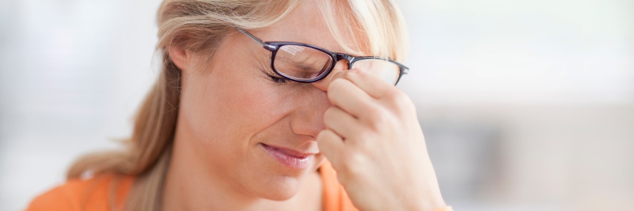 Asthma, Type 2 Diabetes: Asking Someone Why They're Sick woman pinching the bridge of her nose in frustration