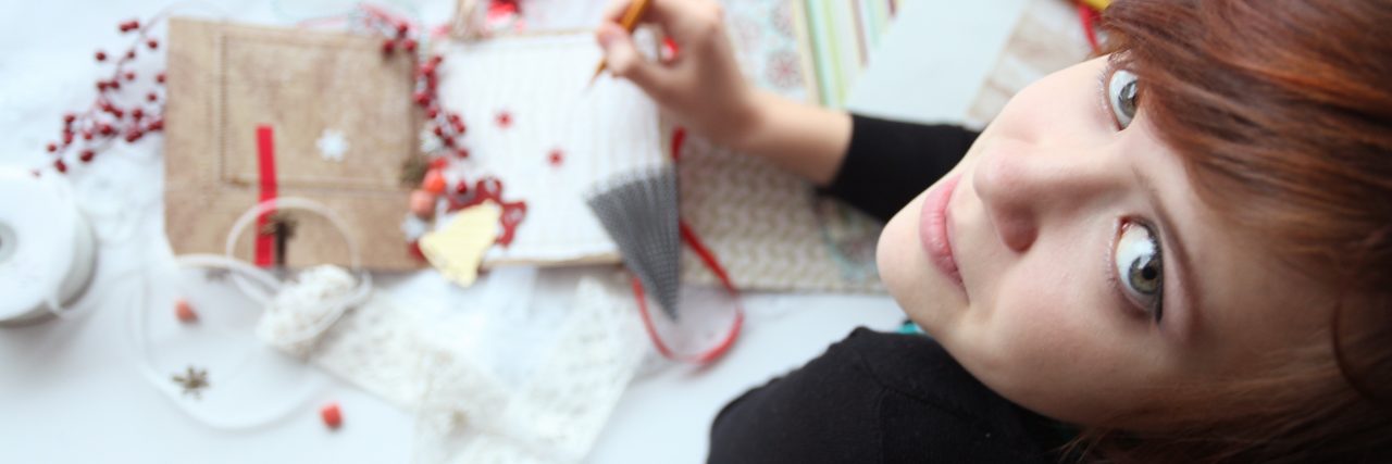 Depression Therapy Exercise That Worked for Me Using Childhood Photos scrapbooking girl working