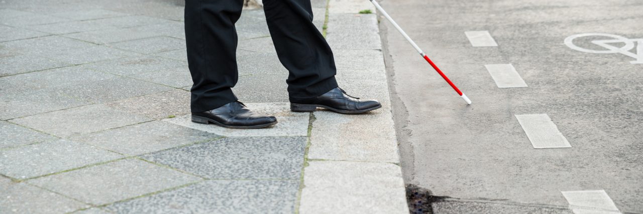 Community Orientation and Mobility Is Essential for Blind Children Blind man crossing the street.