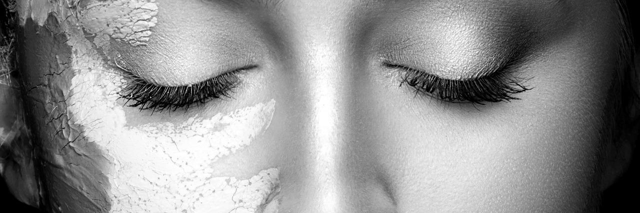 Showing Society What's Behind the Disability Woman with partial mud mask on her face.