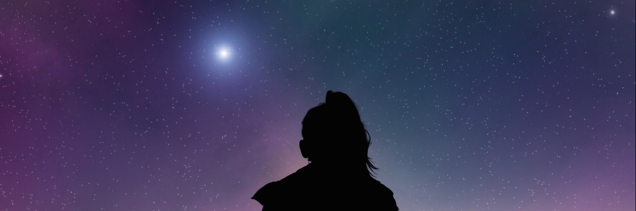 Illustration of woman sitting on a bench, facing starry night sky