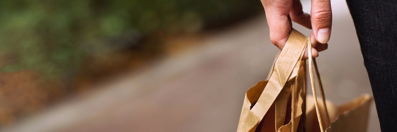 Adjusting to Life With Chronic Obstructive Pulmonary Disease, Anxiety woman carrying shopping bags and walking outside