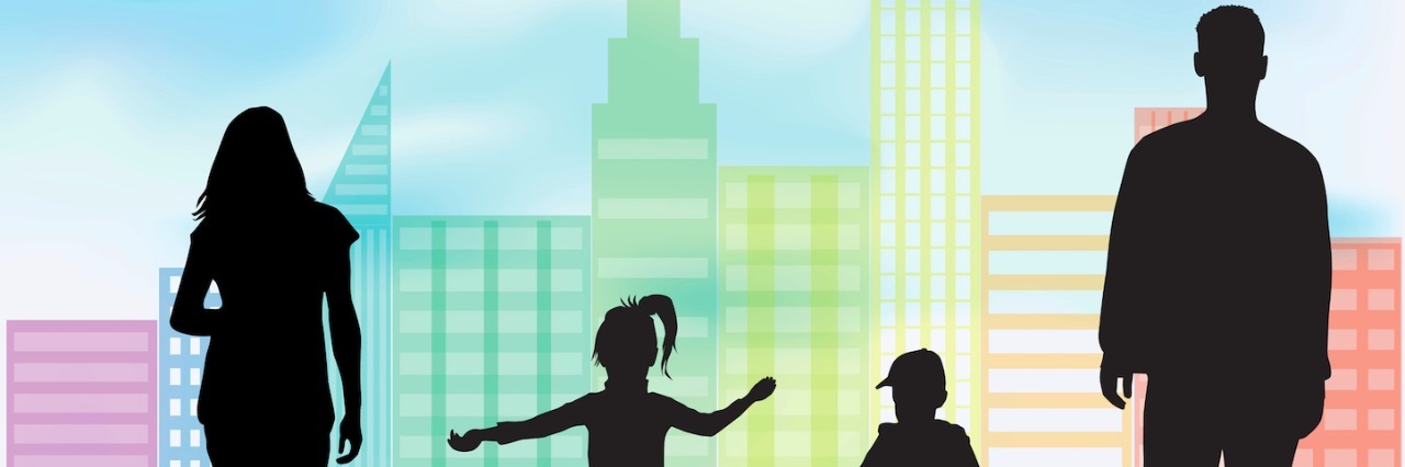 Autism Acceptance: Embracing Us for Who We Are Silhouettes of man, woman, boy and girl on grass in front of city buildings