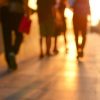 Blur silhouette of people walking on walkway in twilight