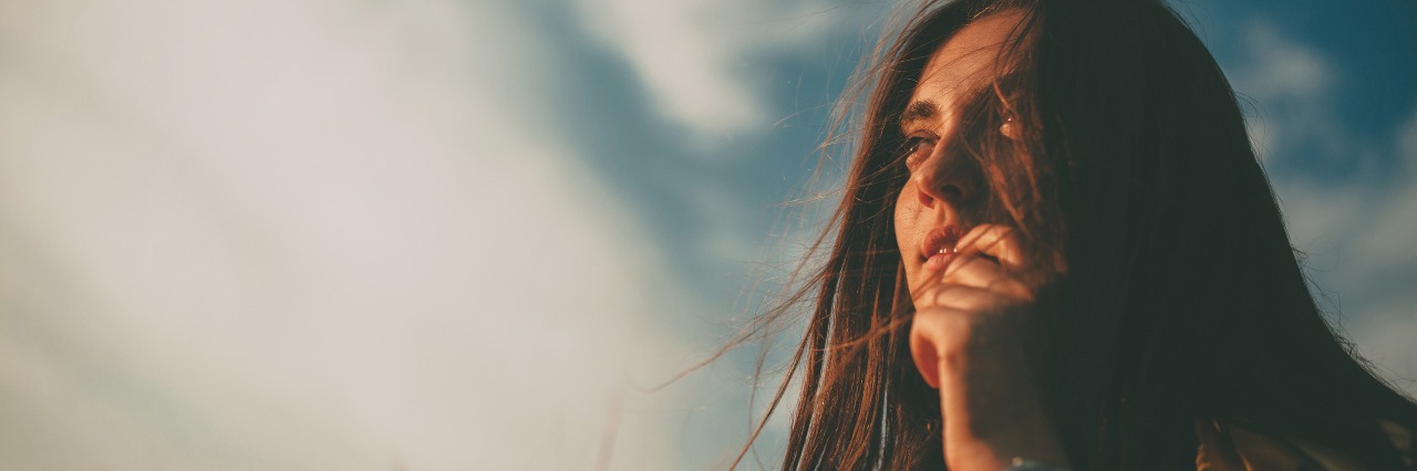 My Personal Experience of My First Month of Antidepressants woman with long hair standing in field