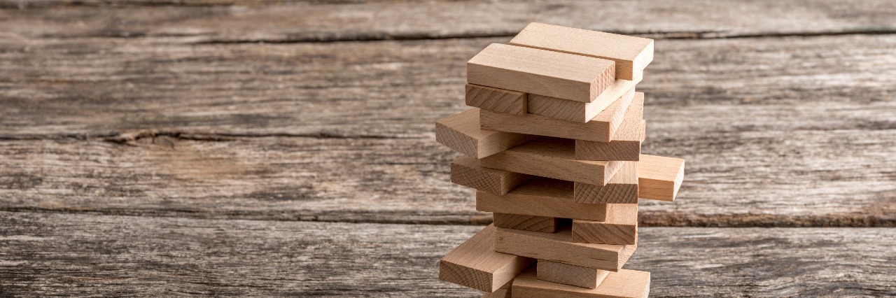Why Addiction Recovery Is Like a Game of Jenga wooden pegs in a tower structure jenga game