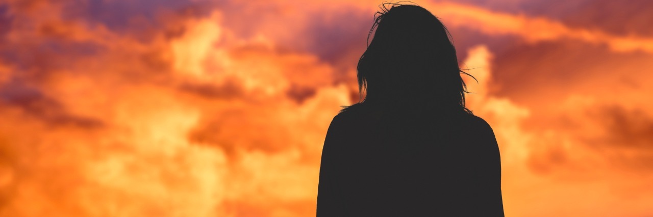Toni Bernhard: What the Healthy Can Learn from the Sick silhouette of woman looking at sunset sky