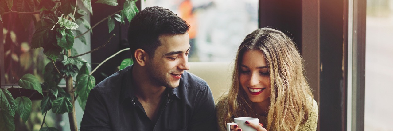 What Dating Feels Like When You Have Anxiety Couple in love drinking coffee and have fun in coffee shop. Love concepts. Vintage effect style picture