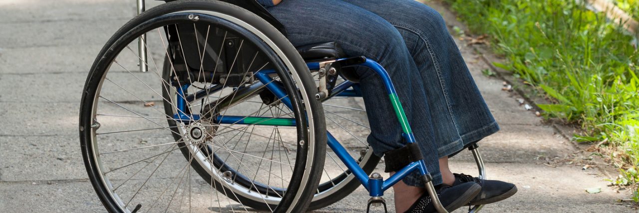 My Disability Is Part of Who I Am Girl in wheelchair sitting outside.