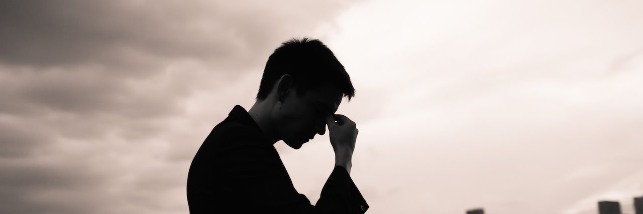 I Used to Think Mental Illness Wasn't Real A silouette of a man