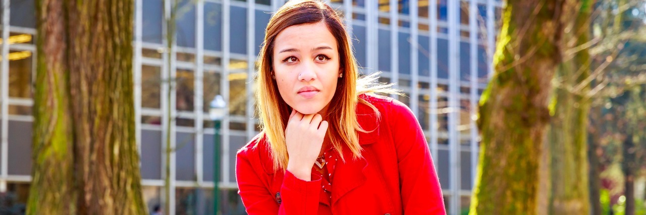 Dropping out of College Was Beneficial for Depression Recovery A young female college student study books outside of library.