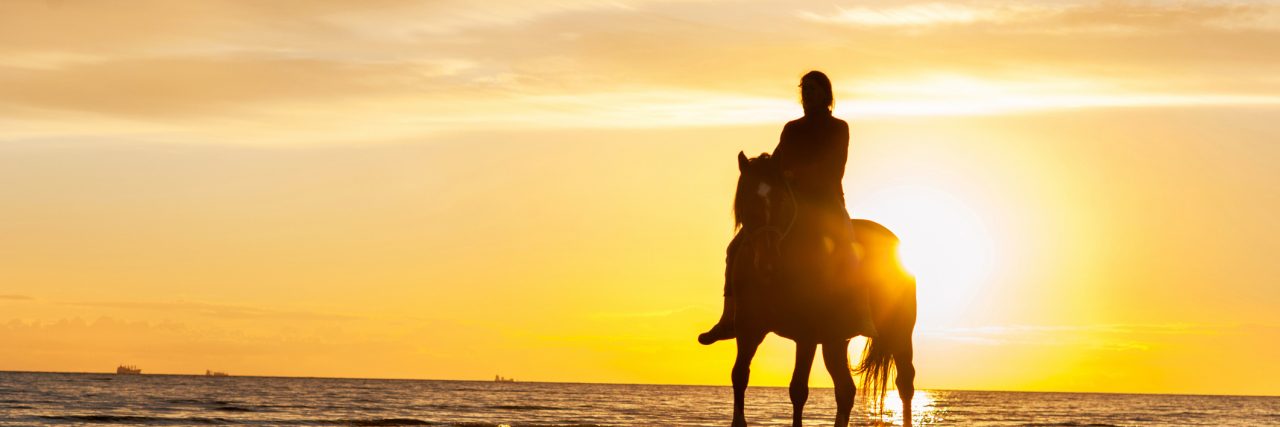 What It Feels Like to Have Mild Cerebral Palsy Horse riding at the beach at sunset.