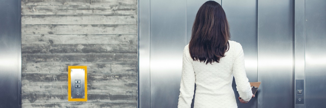 Why I Take the Elevator With Complex Regional Pain Syndrome woman waiting for elevator