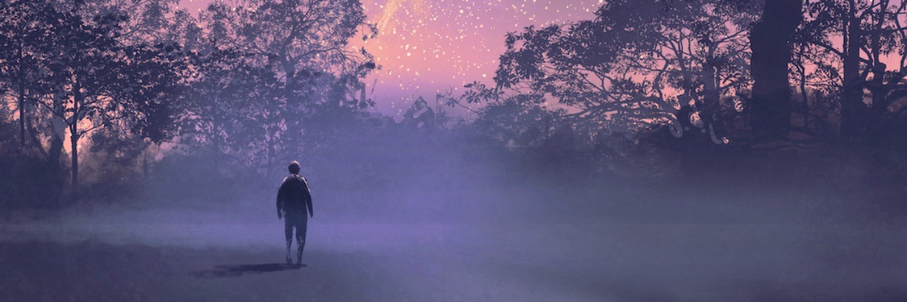 The Nightmares I Have as Someone With Anxiety A man sitting outside looking at the night sky