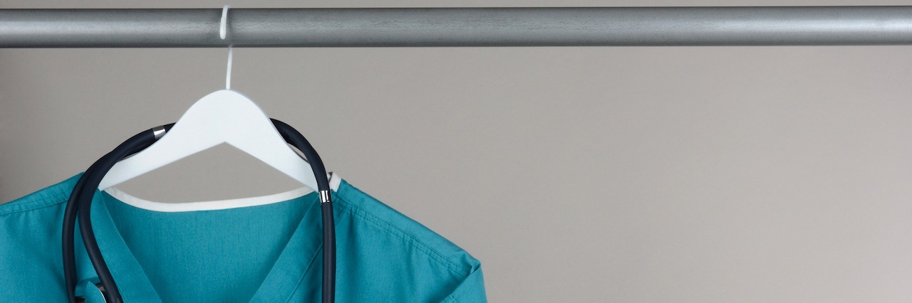 A Day in the Life of a Nursing Student With Bulimia A nurse's scrub shirt hanging up in a closet
