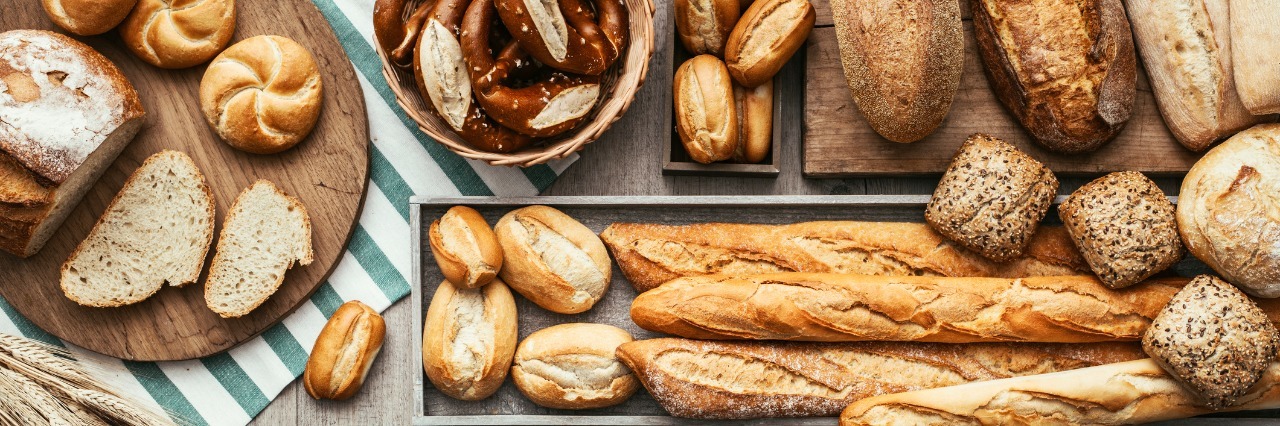 Adjusting My Family to a Gluten-Free Diet to Help My Son's Celiac Freshly baked delicious bread on a rustic wooden worktop