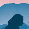 Silhouette of woman's face in front of mountains