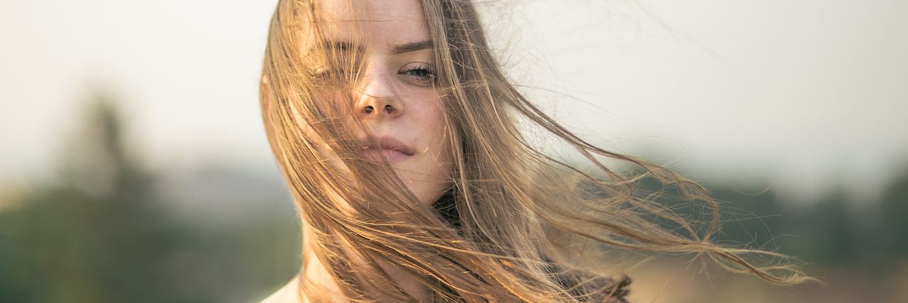 Woman with wind blowing through her hair