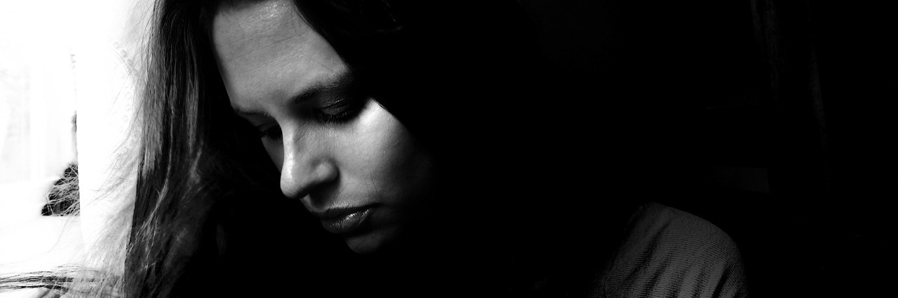portrait o young woman in deep thought, love, hope, loss, grief, sadness