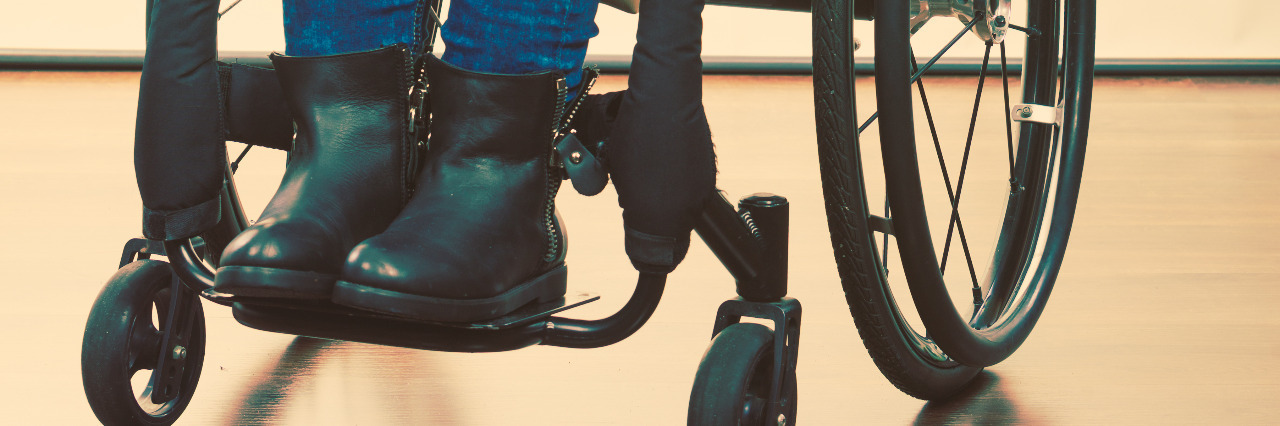 Young woman in wheelchair.