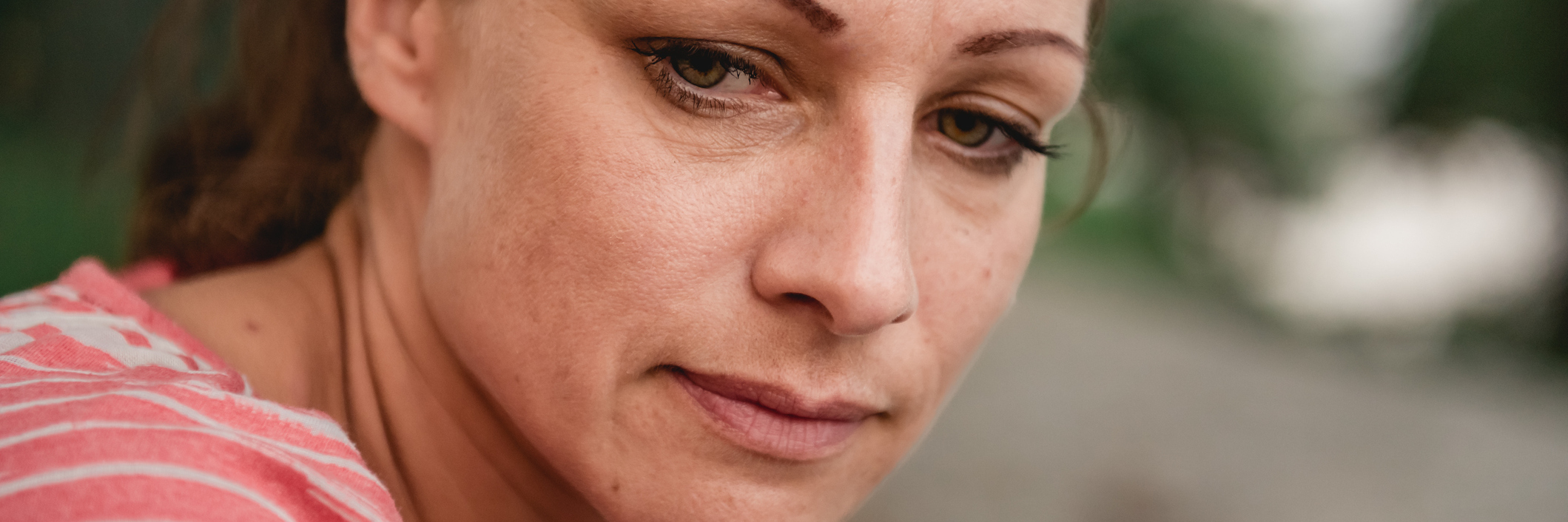 The Motives Behind My Self-Harming Portrait of sad woman sitting in the park