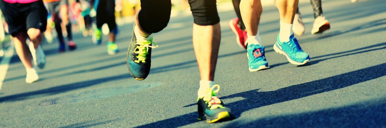 How the 'Marathon' Analogy Describes Getting My Bipolar Diagnosis Unidentified marathon athletes legs running on city road