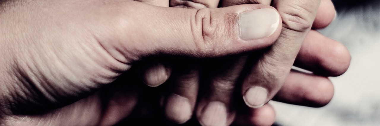 Grief After Loss: What to Say When Everything Is Not OK Close-up of two people holding each other's hands