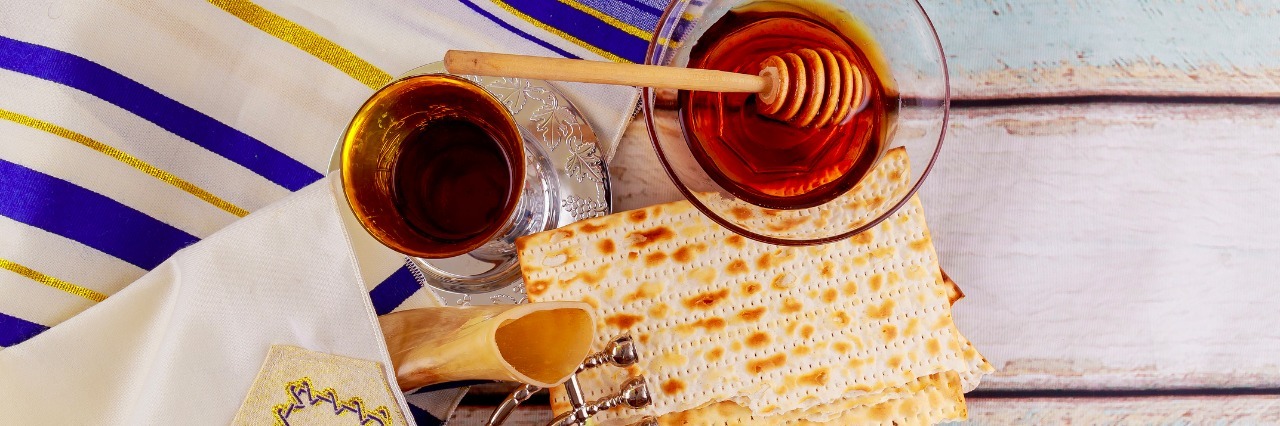 I Don't Fast for Yom Kippur Because of My Eating Disorder Jewish holiday hannukah low key image of jewish holiday Hanukkah with menorah traditional Candelabra and wooden dreidels spinning top . glitter overlay