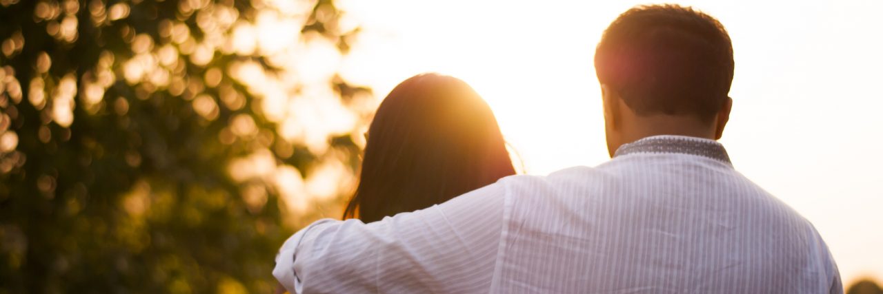 When Anxiety Tells Me I'm Not a Good Spouse couple embracing during sunset