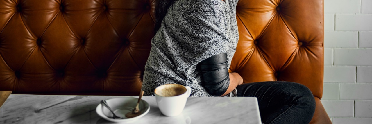 What It Was Like Losing My Job Because I Was Sick Woman Drinks Coffee Shop Lonely Concept