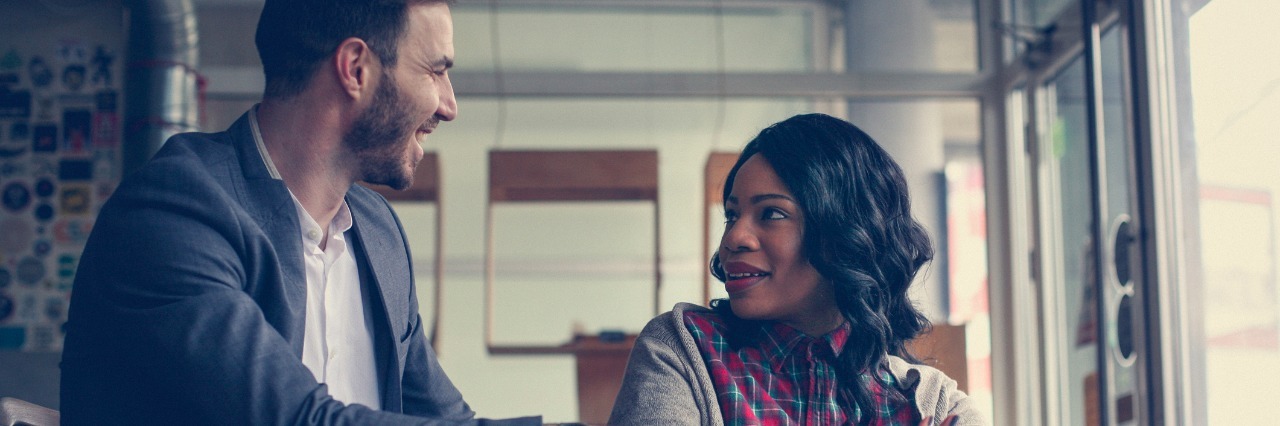 How to Turn Sympathetic Statements Into Empathetic Ones Young business people having discussion.