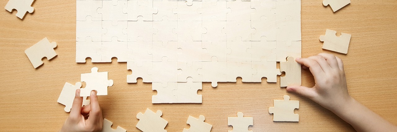 Dealing With Chronic and Mental Illnesses in Your 20s several people assembling a puzzle