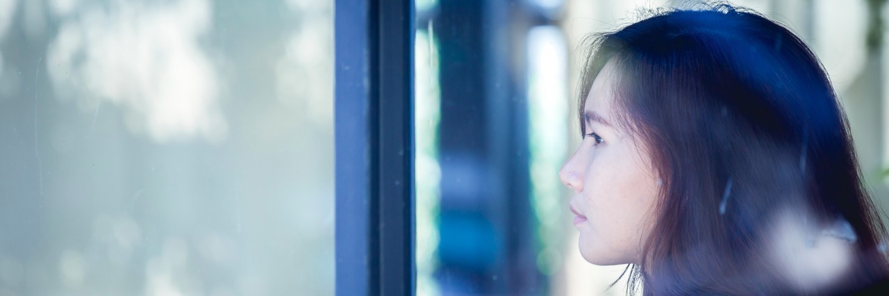 When Depression Actually Makes You Feel Safe teenage hipster in thinking alone at cafe. Backside woman in sitting.