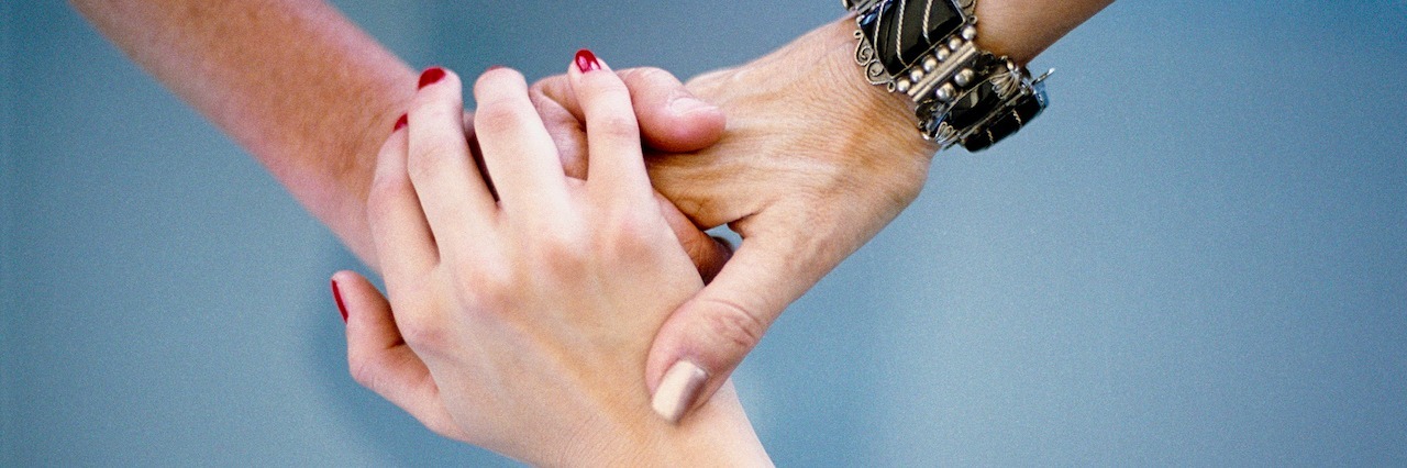 Early Assessment, Support and Treatment for Psychosis Webinar Three people holding hands