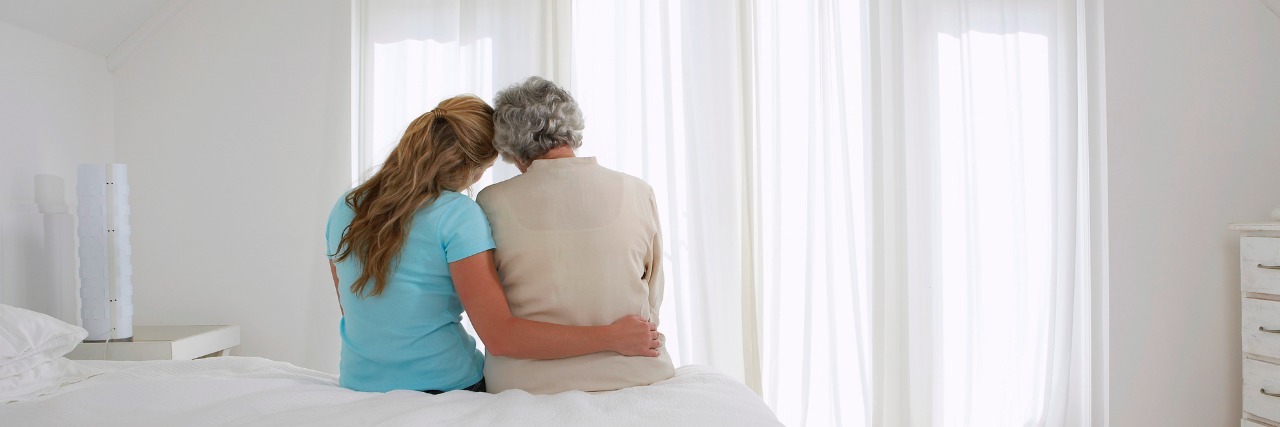 Growing Up With a Mom With Von Hippel-Lindau Syndrome and My Diagnosis Mother and Daughter Sitting on Bed