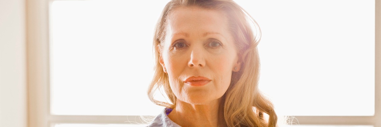 How Eating Disorder Recovery Prepared Me For Getting Older A woman standing in front of a window