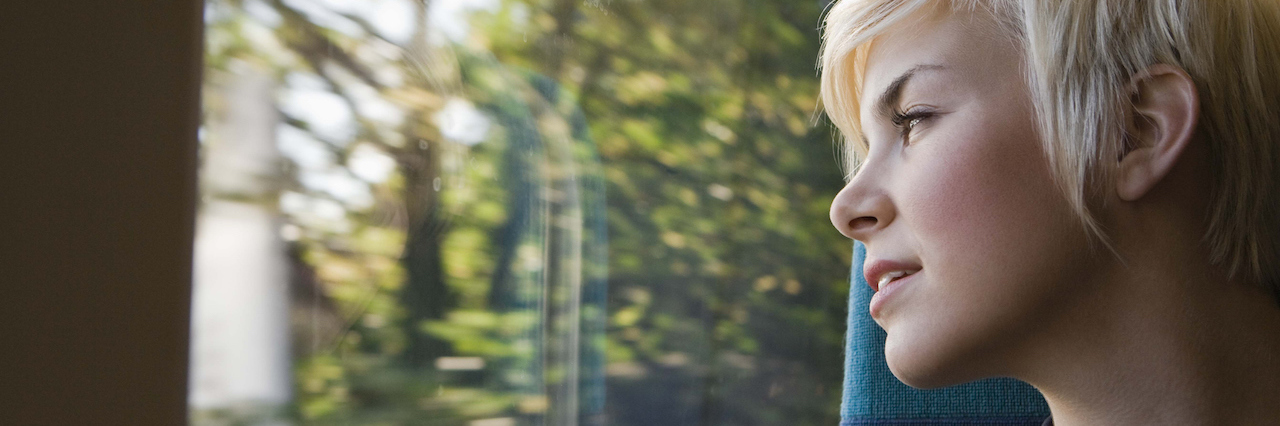 Diagnosed With Bipolar Disorder After Thinking You Have Depression A woman looking out the window at trees