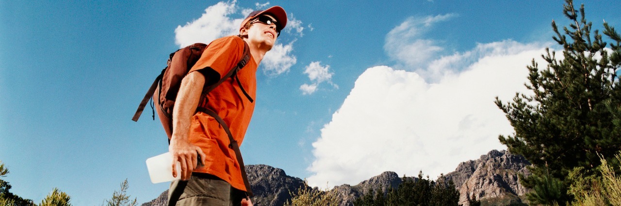 Recovering From C-PTSD Is Like Climbing a Mountain young man hiking