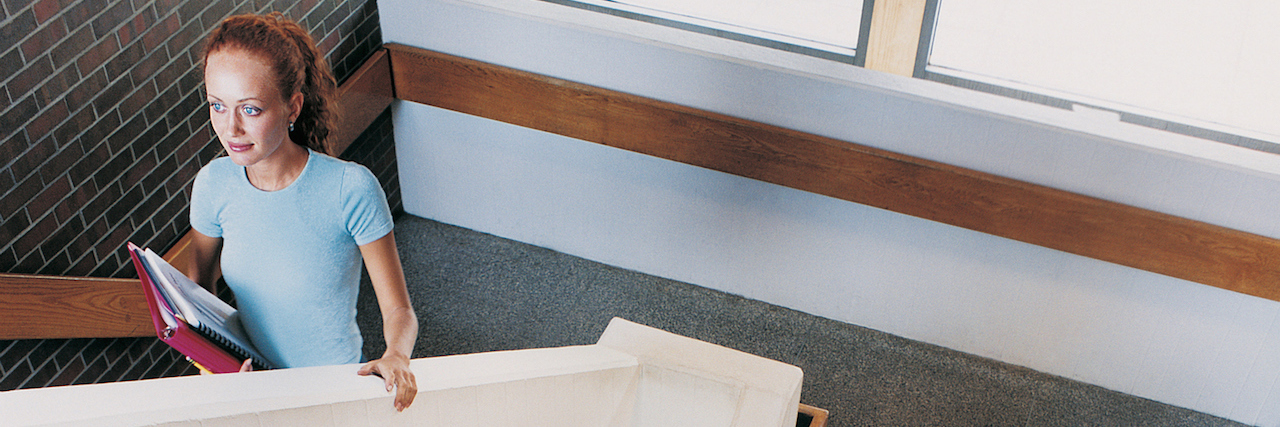 Going to College While Struggling With Anorexia A woman walking up the stairwell at school