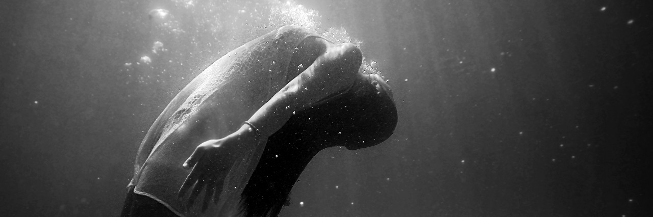 black and white woman underwater