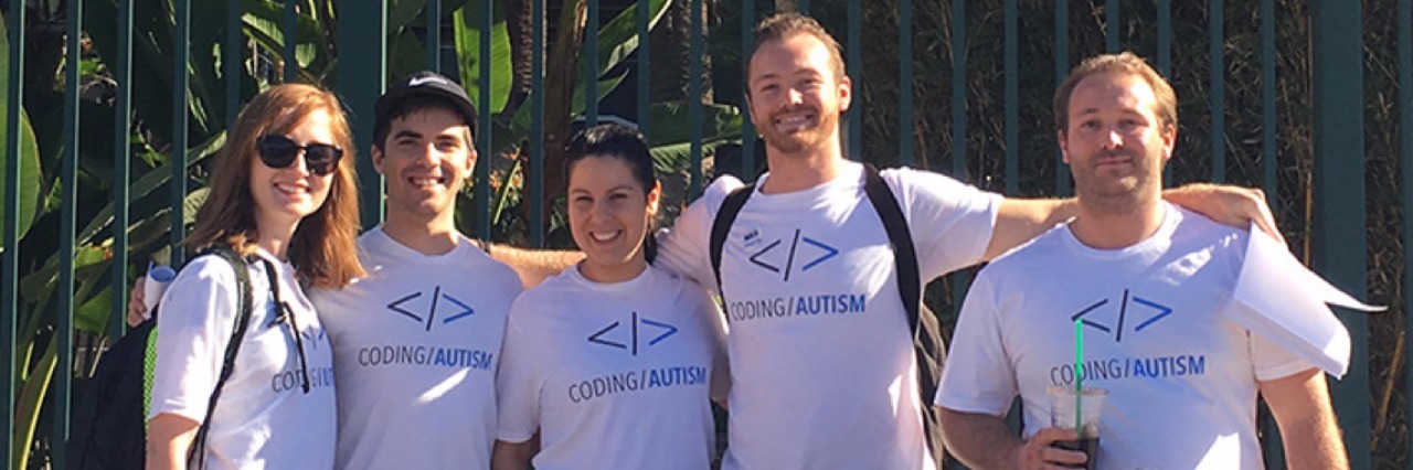 group photo of people wearing coding autism shirts