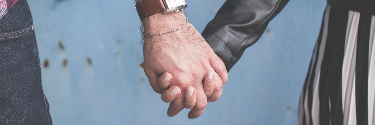 A Letter of Support to Anyone Who Is Feeling Worthless man and woman holding hands in front of concrete wall