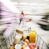 shopping cart in grocery store with blurry surroundings