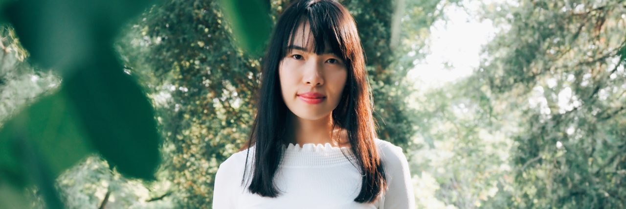 When I Say I'm Struggling With Bipolar Disorder and Suicidal Thoughts woman in forrest