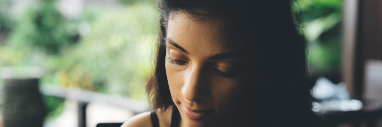 Why I'd Call Post-Traumatic Stress Disorder 'a Disorder of Doubt' woman looking down